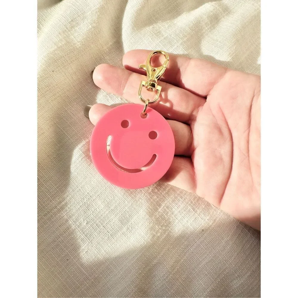 Hot pink smiley face keychain
